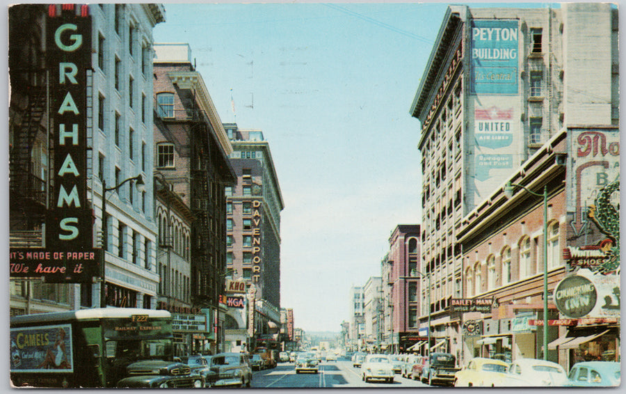 Spokane WA looking East on Sprague United Airlines Peyton Building 1955 Postcard